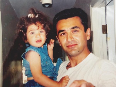 Izabel Pakzad in the arms of her father Alex Pakzad.
